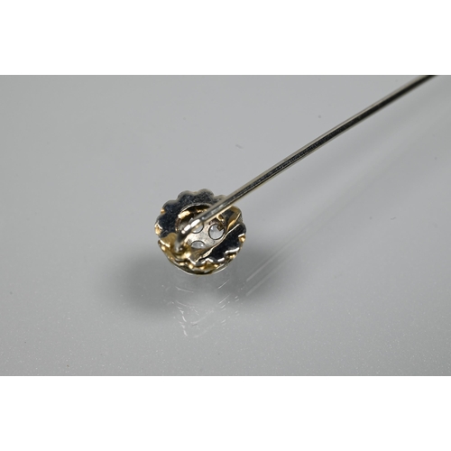 220 - A white metal stick pin set with six white spinel as a cluster, 5.5 cm long