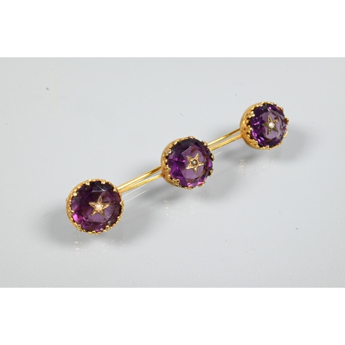 223 - A Victorian rivière necklace, formed of twenty four foil-backed oval faceted purple pastes in gilt m... 