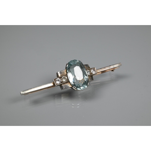 224 - An Art Deco style bar brooch, the central oval pale blue paste in rectangular setting with two round... 