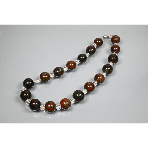 231 - A moss agate bracelet formed of chain-linked oval discs, a Victorian piqué work brooch and a ... 