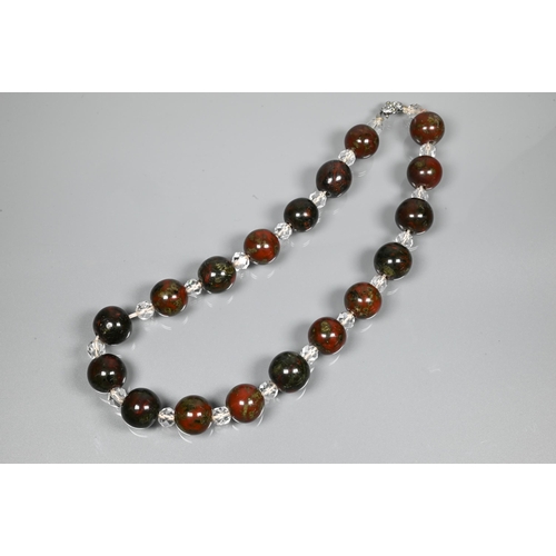 231 - A moss agate bracelet formed of chain-linked oval discs, a Victorian piqué work brooch and a ... 