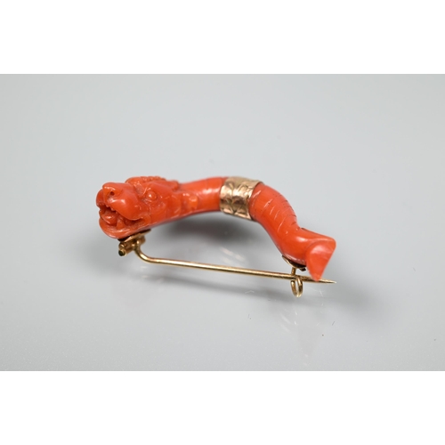 235 - An antique Chinese coral carved dragon yellow metal mounted brooch, 3.5 cm long, 5 g all in