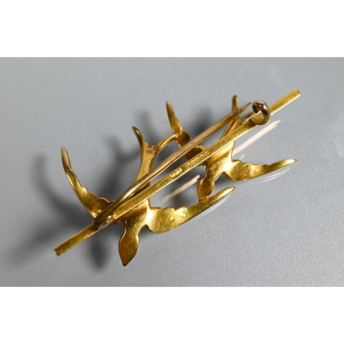 240 - A Victorian 9ct yellow gold bar brooch with two flying swallows with outstretched wings, set overall... 