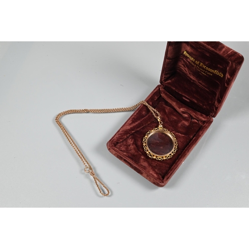 241 - A 9ct rose gold belcher chain with vacant spectacle mount locket attached, with bead and scroll surr... 