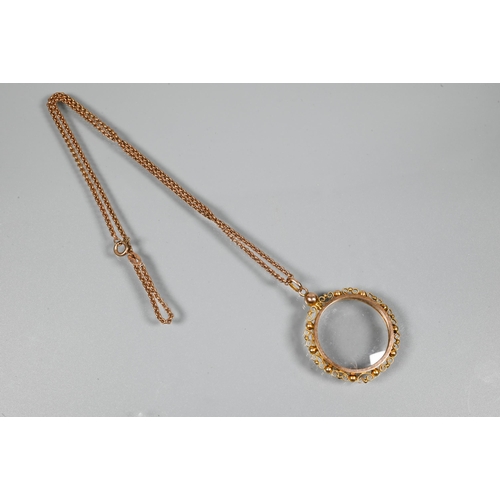 241 - A 9ct rose gold belcher chain with vacant spectacle mount locket attached, with bead and scroll surr... 