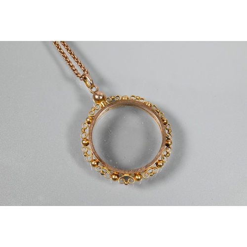 241 - A 9ct rose gold belcher chain with vacant spectacle mount locket attached, with bead and scroll surr... 