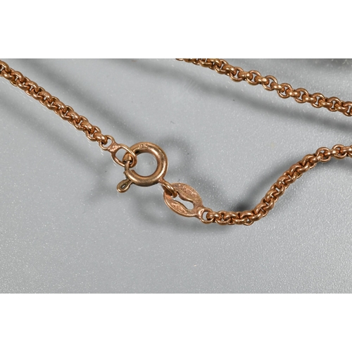 241 - A 9ct rose gold belcher chain with vacant spectacle mount locket attached, with bead and scroll surr... 