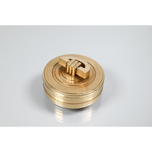 243 - Cartier - A 9ct yellow gold Art Deco circular pill box with reed banded decoration and 'D' shaped ha... 