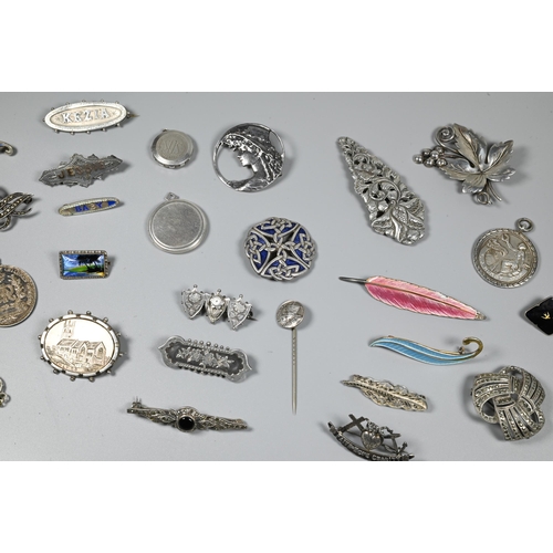 246 - A collection of Victorian and later silver and white metal brooches, pendants and pins including Nor... 