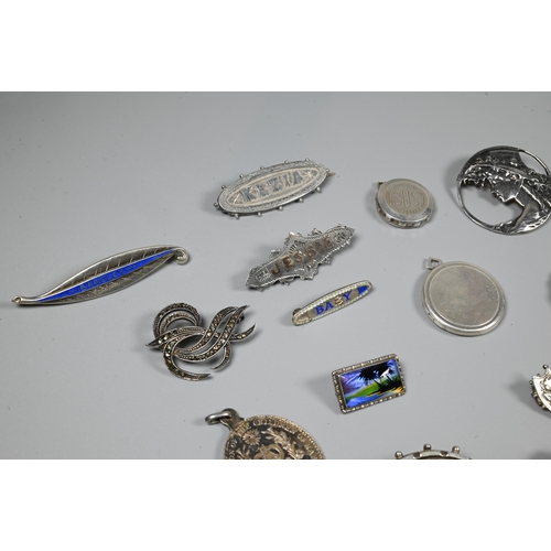 246 - A collection of Victorian and later silver and white metal brooches, pendants and pins including Nor... 