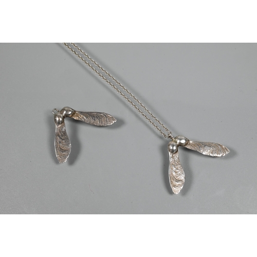 248 - Two white metal pendants in the form of naturalistic sycamore seed pods, and a white metal chain, st... 