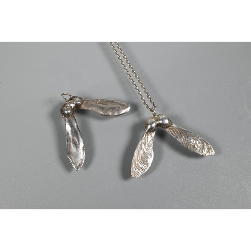 248 - Two white metal pendants in the form of naturalistic sycamore seed pods, and a white metal chain, st... 