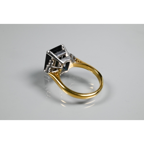 250A - An Art Deco style ring set with rectangular dark blue sapphire (probably), with triple diamond set s... 