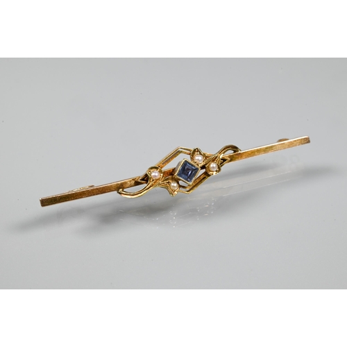 253 - An Edwardian bar brooch set with four small seed pearls and blue stone, yellow metal set stamped 15c... 