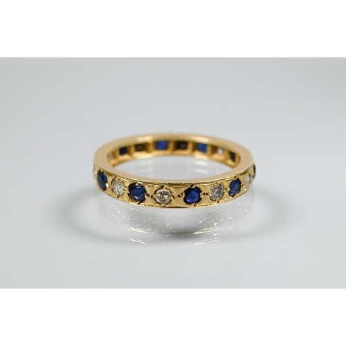 256 - A sapphire and diamond full eternity ring, the alternating stones set within unmarked yellow metal b... 