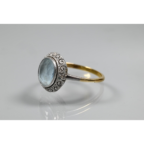 260 - An oval pale aquamarine in yellow and white metal setting, size O