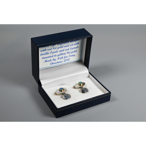 266 - A pair of contemporary silver 'Eye' cufflinks inlaid with rose-coloured 9ct gold and set with double... 