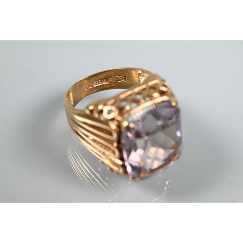 270A - A 9ct yellow gold ring set large rectangular quartz, in high cage-style setting with open ribbed sho... 