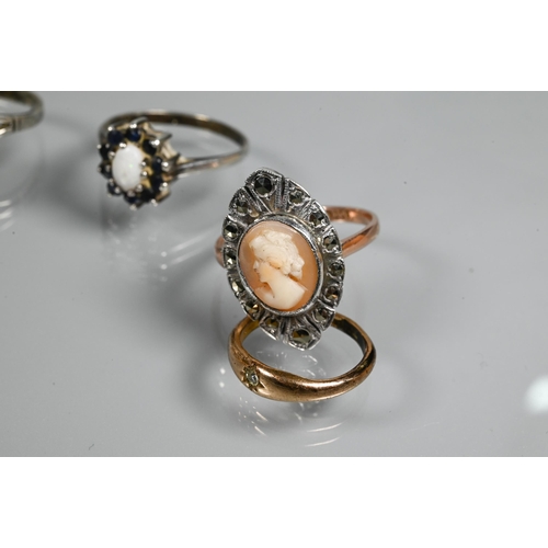 274 - Five various stone set rings, including one diamond, a lucite oval brooch featuring reverse carved b... 