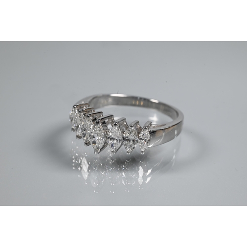 276 - A seven stone diamond ring set 18ct white gold, the graduated marquise shaped diamonds in high claw ... 