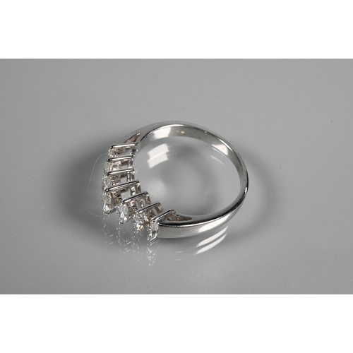 276 - A seven stone diamond ring set 18ct white gold, the graduated marquise shaped diamonds in high claw ... 