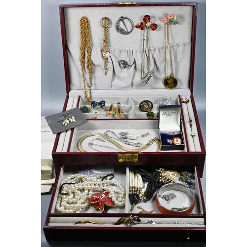 285 - A jewel case containing vintage and later jewellery including brooches, pearls, beads, bangle etc