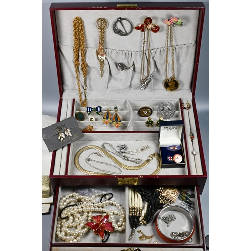 285 - A jewel case containing vintage and later jewellery including brooches, pearls, beads, bangle etc