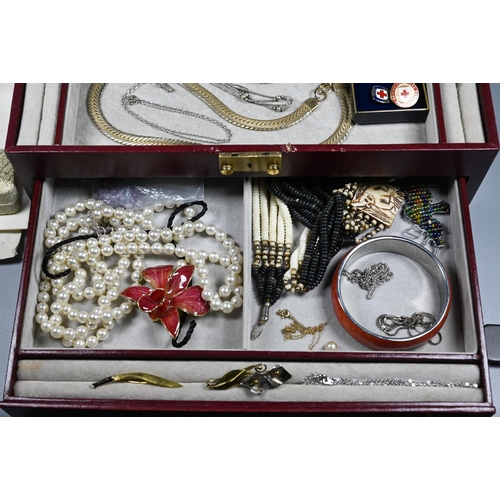 285 - A jewel case containing vintage and later jewellery including brooches, pearls, beads, bangle etc