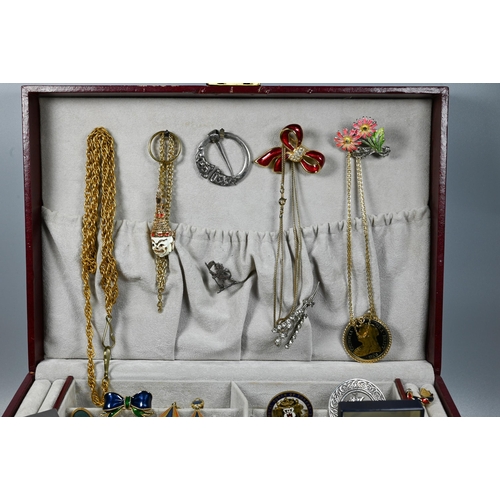 285 - A jewel case containing vintage and later jewellery including brooches, pearls, beads, bangle etc