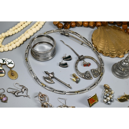 288 - A collection of jewellery including beads, necklaces, earrings, brooches, compact, silver napkin rin... 