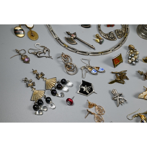 288 - A collection of jewellery including beads, necklaces, earrings, brooches, compact, silver napkin rin... 