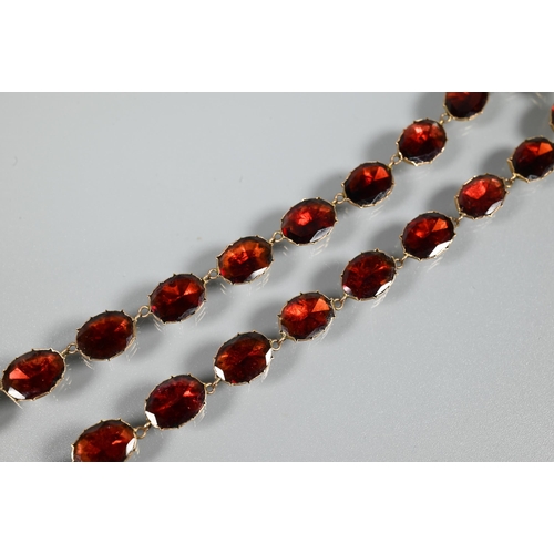 289 - A Victorian oval garnet set necklace in 9ct yellow gold closed back setting, concealed clasp with sa... 