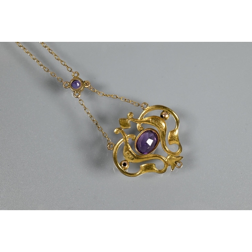 301 - An Art Nouveau pendant, the 9ct yellow gold open scroll design with central oval shaped amethyst, su... 