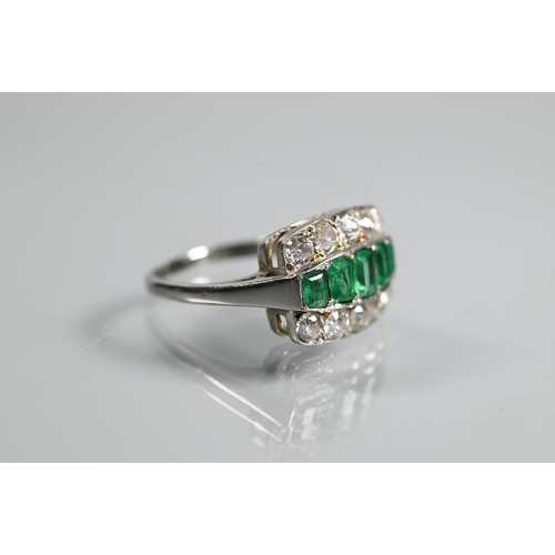 310 - An emerald and diamond three row Art Deco style ring, the central row with five graduated baguette c... 