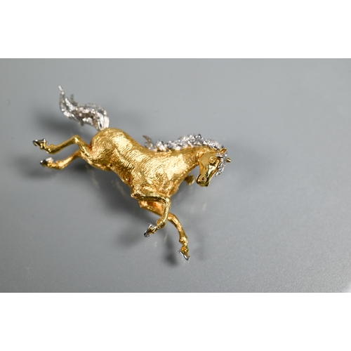 319 - An 18ct yellow and white gold brooch in the form of a galloping stallion, with textured body and dia... 