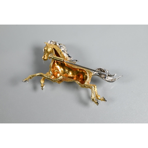 319 - An 18ct yellow and white gold brooch in the form of a galloping stallion, with textured body and dia... 