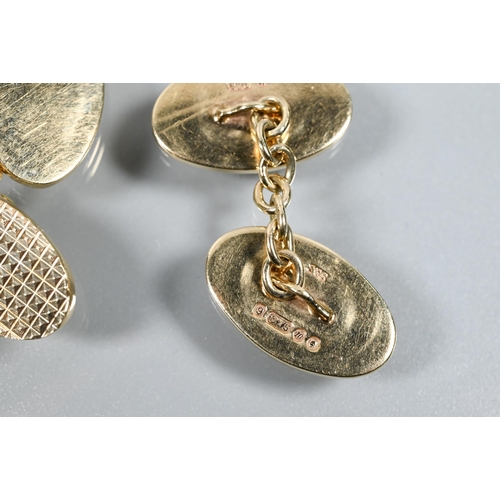 326 - A pair of oval 9ct yellow gold chain-linked cufflinks with hatched decoration, approx 12.6g, in blac... 