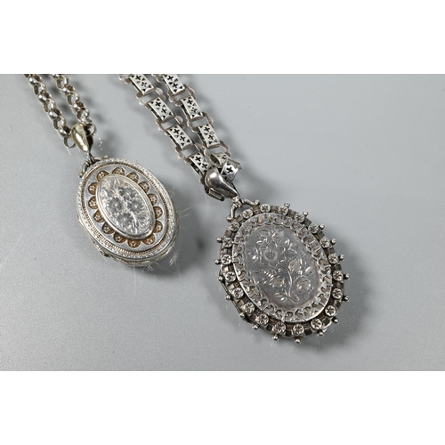 330A - Two Victorian silver oval lockets on chains, one with Gothic style pierced links, the other belcher ... 