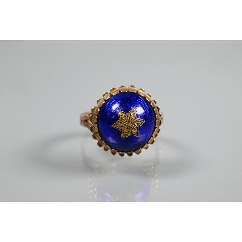 332 - A Victorian ring of blue enamel domed design with inset star motif, 9ct yellow gold set, size P