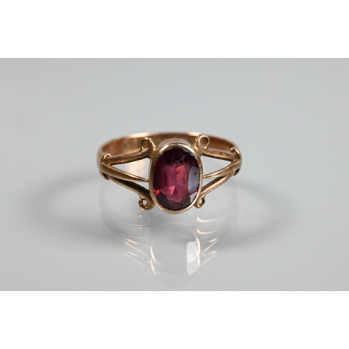 334 - Two 9ct rings, one with split scroll shoulders set with garnet, size N and one set pale blue stone, ... 