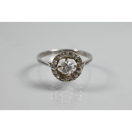 348 - An antique diamond floating halo cluster ring formed of a central old cut diamond with diamond surro... 