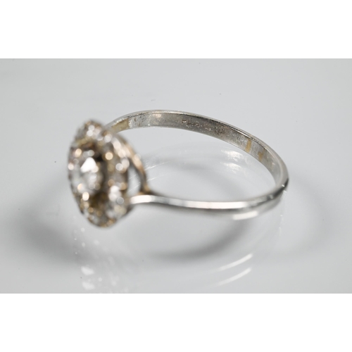 348 - An antique diamond floating halo cluster ring formed of a central old cut diamond with diamond surro... 