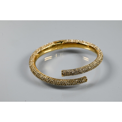 361 - India Hicks - a gilt metal and diamanté bangle in original box to/w a pair of earrings set wi... 