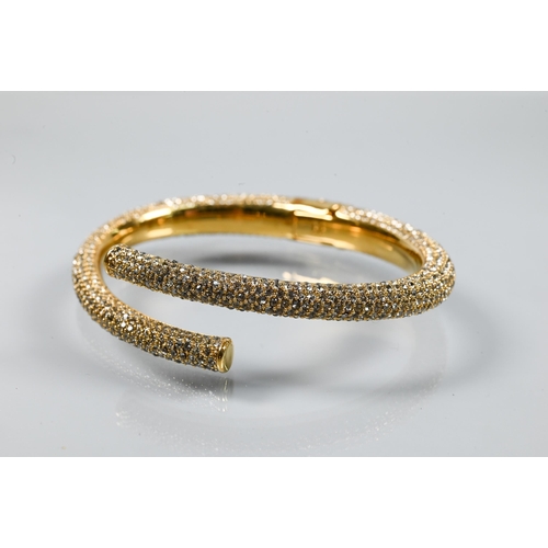 361 - India Hicks - a gilt metal and diamanté bangle in original box to/w a pair of earrings set wi... 