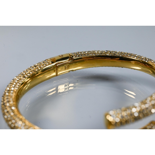 361 - India Hicks - a gilt metal and diamanté bangle in original box to/w a pair of earrings set wi... 