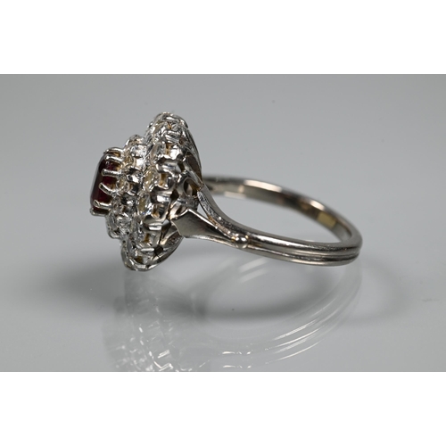 364 - A diamond ruby cluster ring, the oval two row diamond cluster supporting an oval ruby in high claw s... 