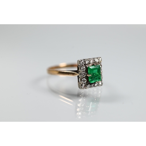 365 - An emerald and diamond cluster ring, the central rectangular cut emerald with diamond surround, unma... 