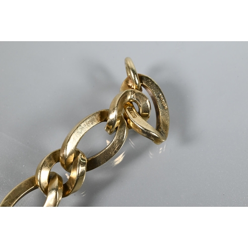 381 - A 9ct yellow gold bracelet formed of elongated open square-edged oval links with curb links between,... 