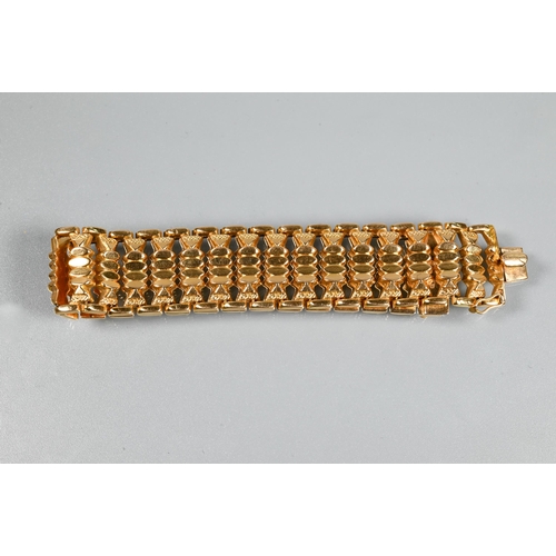 382 - A yellow gold wide bracelet formed of fancy baton links, concealed clasp, stamped 750, approx 29g