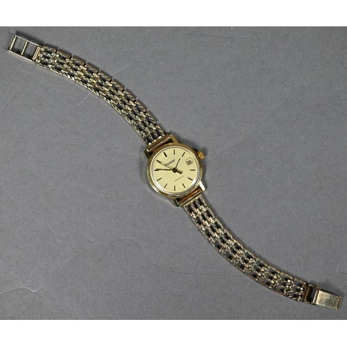 394 - A lady's 18ct gold Tissot Seastar wristwatch, the 18mm champagne dial with date aperture, on 9ct gol... 